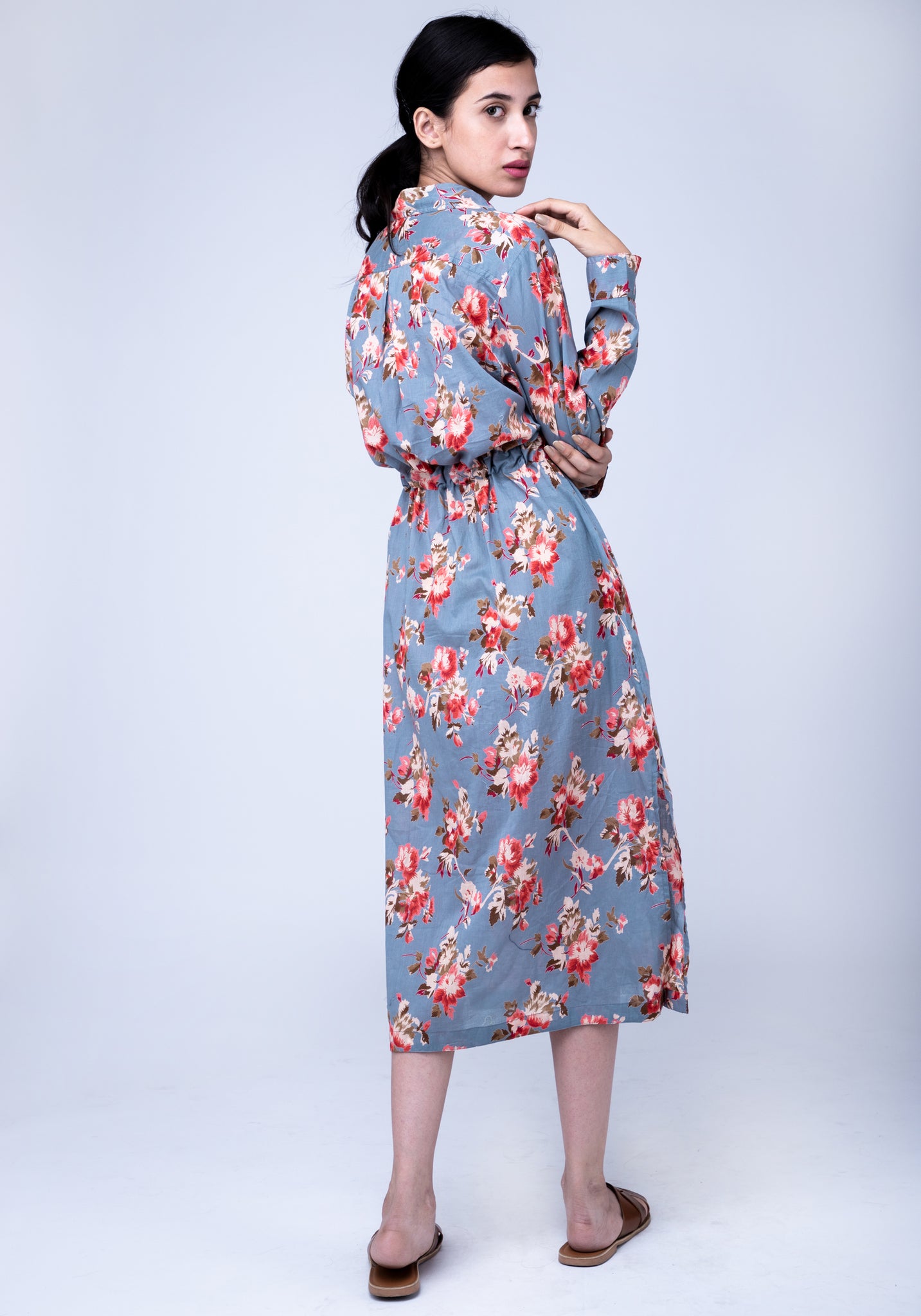 A long shirt dress with patch pockets ...